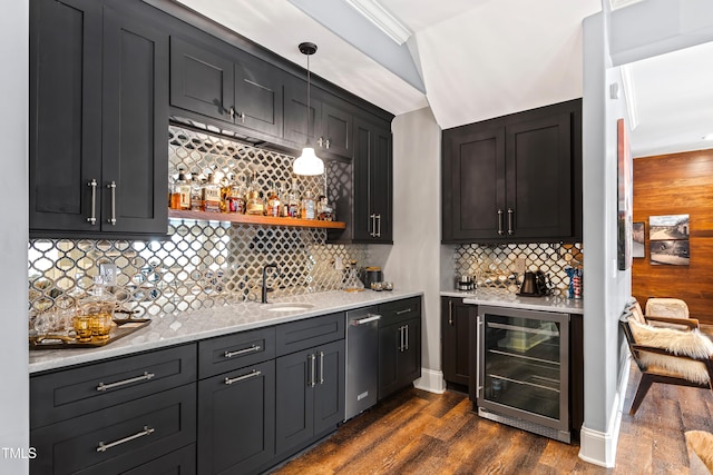 bar featuring beverage cooler, a sink, dark wood finished floors, and wet bar