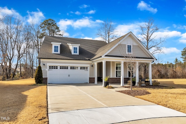 view of front facade featuring a garage and covered porch