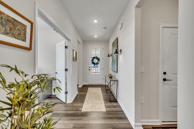 hall with dark wood-type flooring