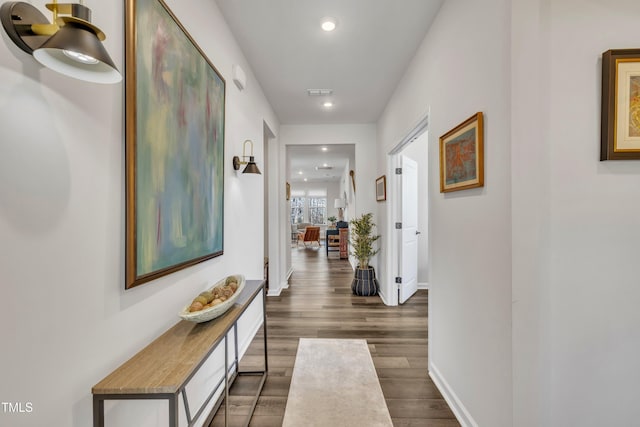 hallway featuring dark wood-type flooring