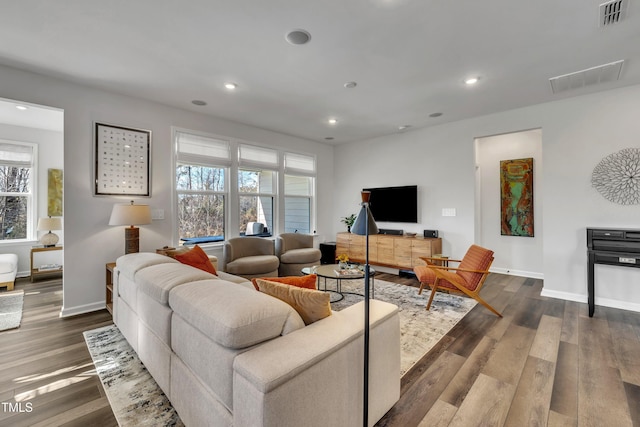 living room with dark hardwood / wood-style flooring