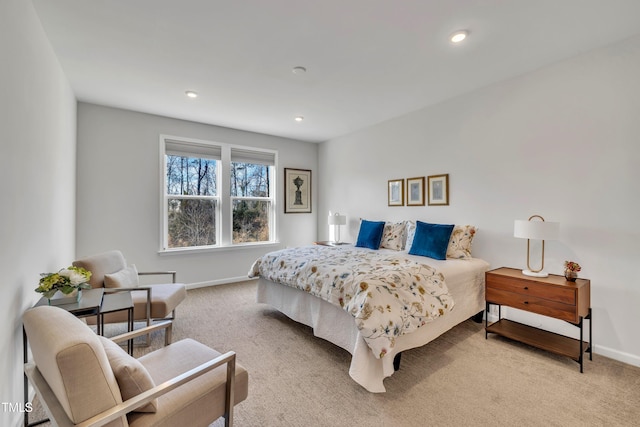 bedroom featuring light carpet