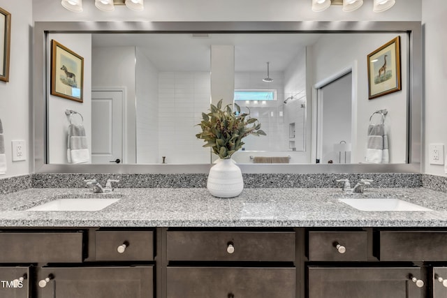 bathroom featuring vanity and tiled shower