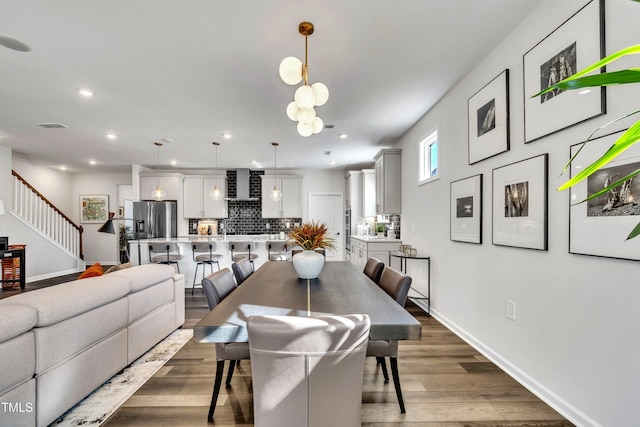 dining area featuring dark wood-type flooring