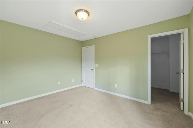 unfurnished room featuring light colored carpet