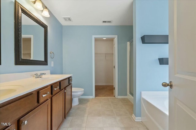 full bathroom with vanity, toilet, separate shower and tub, and tile patterned flooring