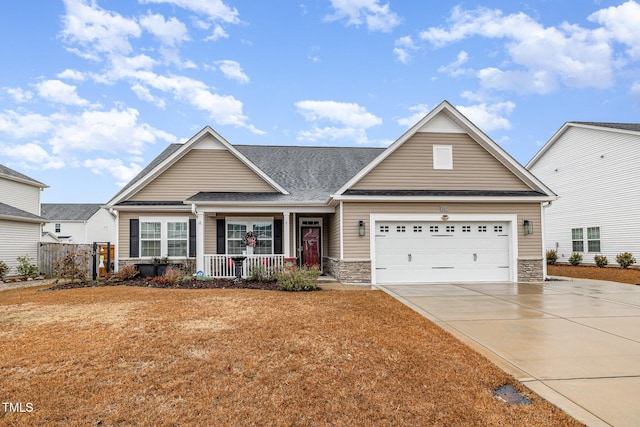 craftsman-style home featuring a porch and a garage