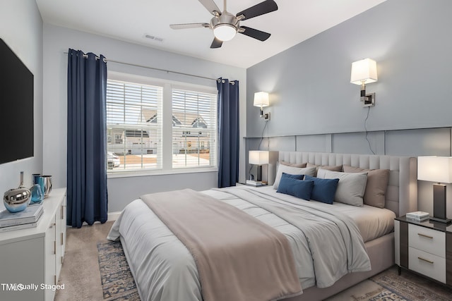 carpeted bedroom with ceiling fan