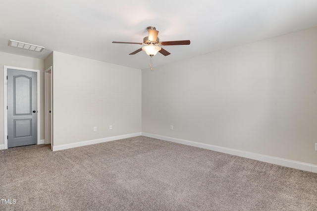 carpeted spare room with ceiling fan