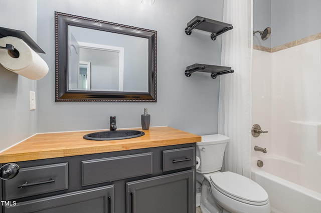 full bathroom with vanity, tub / shower combination, and toilet