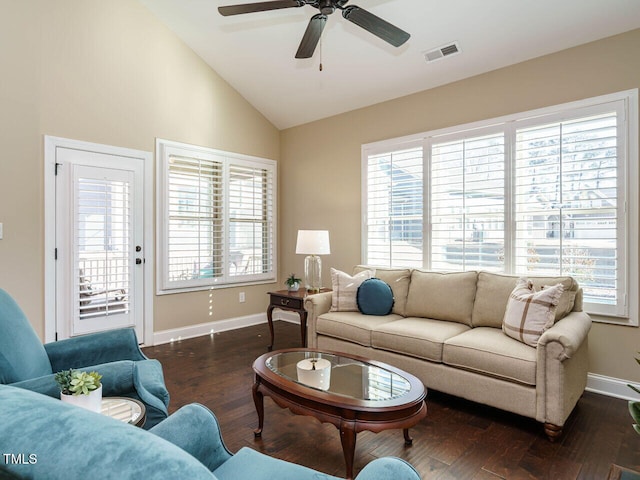 living room with ceiling fan, dark hardwood / wood-style flooring, and vaulted ceiling