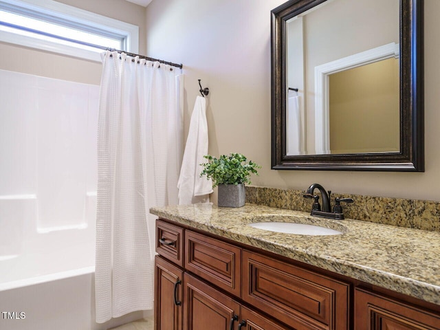 bathroom featuring shower / bath combination with curtain and vanity