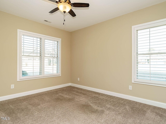 carpeted empty room with ceiling fan