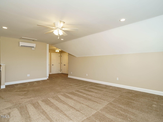 bonus room featuring lofted ceiling, a wall mounted air conditioner, carpet, and ceiling fan