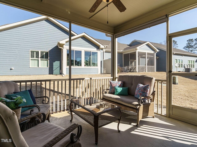 sunroom with ceiling fan