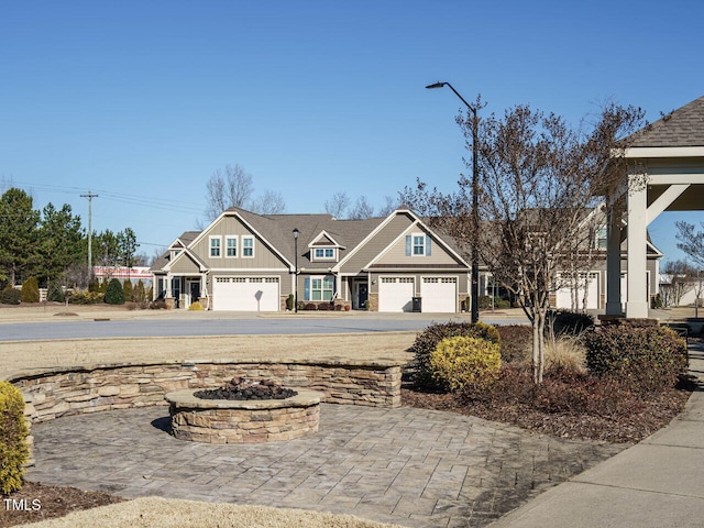 craftsman house featuring an outdoor fire pit