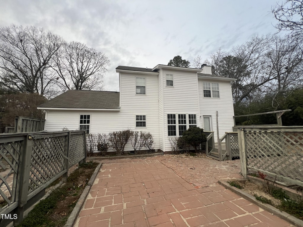 back of property featuring a patio area