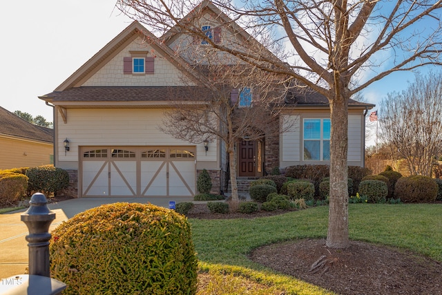 view of front of home with a garage and a front yard