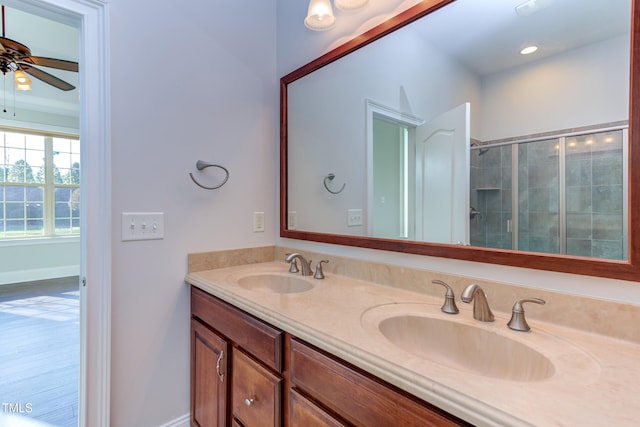 bathroom featuring vanity, a shower with door, and ceiling fan