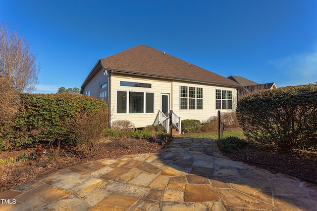 back of property with a patio area