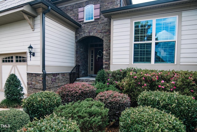 property entrance featuring a garage