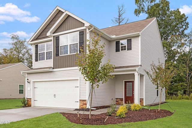 craftsman inspired home featuring a garage and a front yard