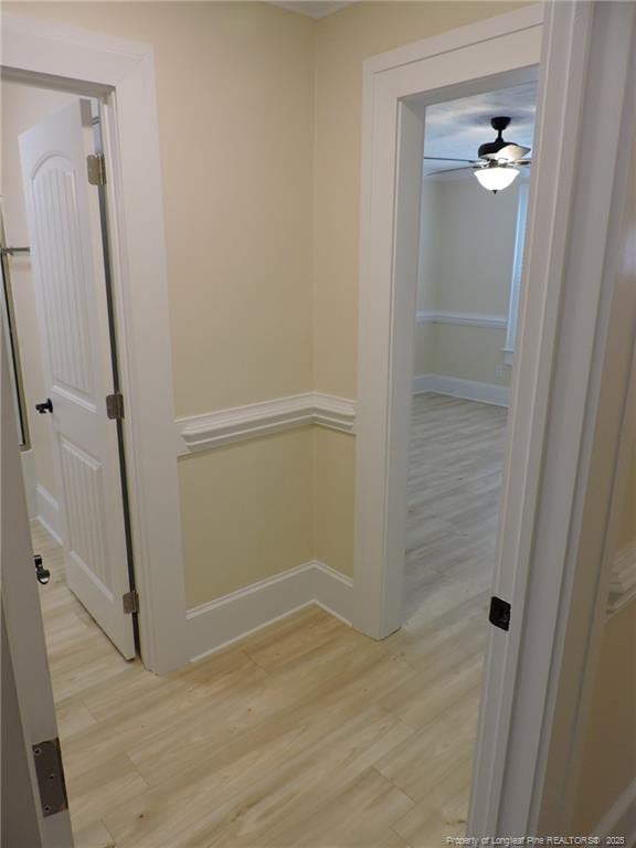 hall with light hardwood / wood-style flooring