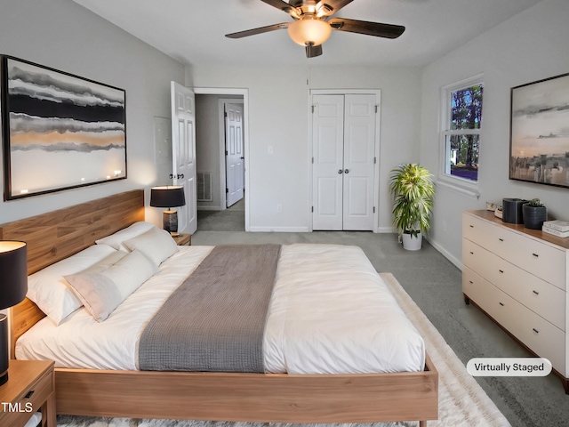 bedroom with ceiling fan, carpet flooring, and a closet