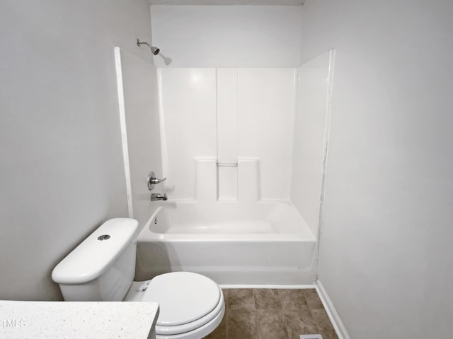 bathroom with toilet and shower / bathing tub combination