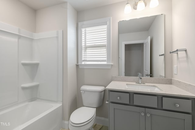 full bathroom featuring vanity,  shower combination, and toilet