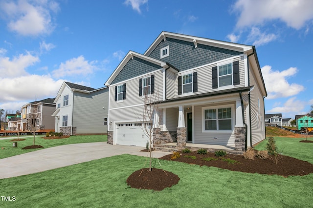 craftsman inspired home featuring a garage, covered porch, and a front yard