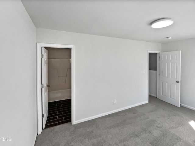 spare room featuring light colored carpet