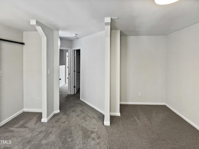 basement with dark colored carpet