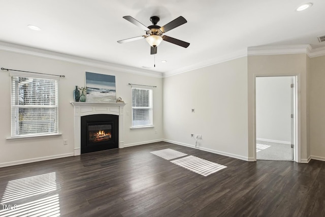 unfurnished living room with dark wood-type flooring, plenty of natural light, and ornamental molding