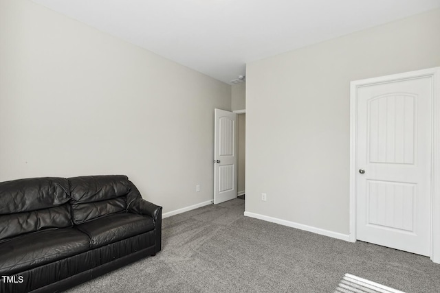 living room with carpet floors and baseboards