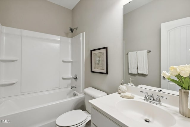 bathroom featuring toilet, shower / washtub combination, and vanity