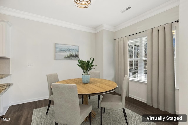 dining space with visible vents, a healthy amount of sunlight, and dark wood finished floors