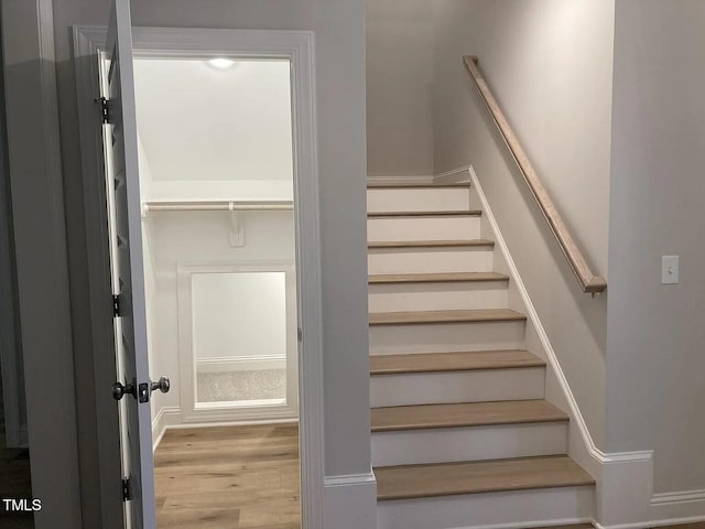 staircase featuring hardwood / wood-style floors