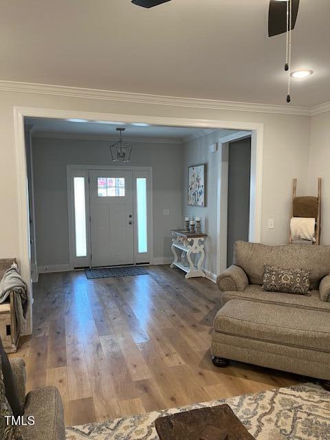 foyer featuring hardwood / wood-style flooring and ornamental molding