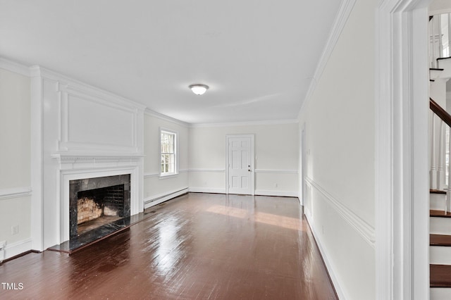 unfurnished living room with ornamental molding, dark hardwood / wood-style floors, a high end fireplace, and a baseboard radiator