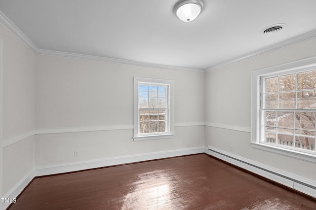 empty room featuring ornamental molding, a baseboard heating unit, and dark hardwood / wood-style flooring