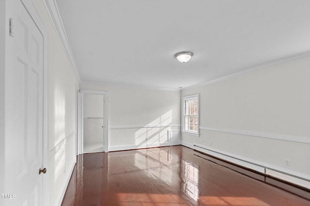 unfurnished room featuring dark hardwood / wood-style flooring, a baseboard heating unit, and crown molding