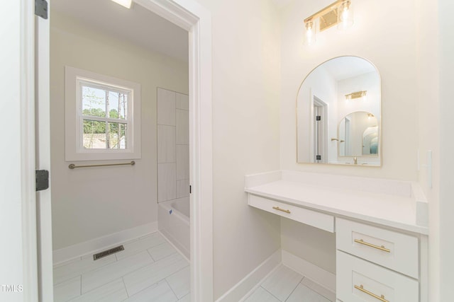 bathroom featuring vanity and shower / tub combination