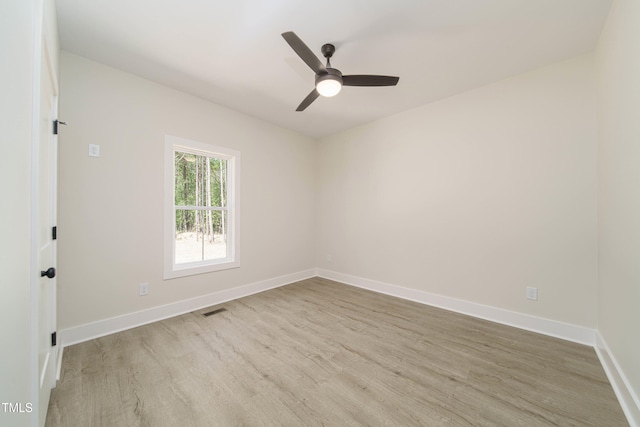 spare room featuring ceiling fan and light hardwood / wood-style floors