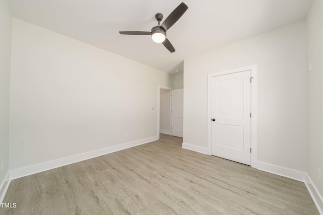 unfurnished bedroom with ceiling fan and light hardwood / wood-style floors