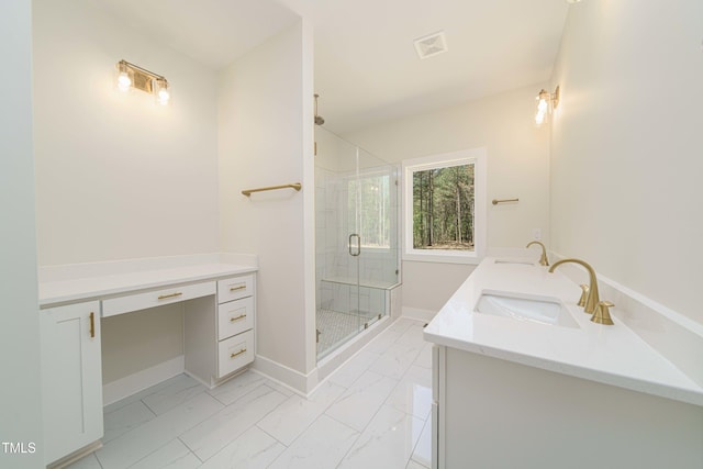 bathroom with a shower with door and vanity