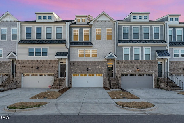 multi unit property featuring a garage