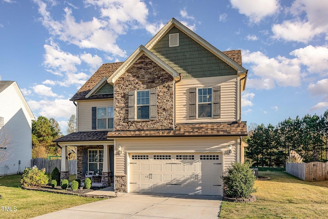 craftsman inspired home with a garage, a porch, and a front yard