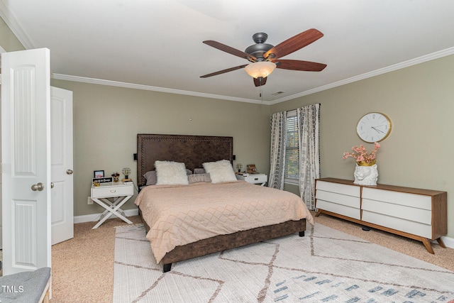 bedroom featuring ceiling fan, ornamental molding, and carpet