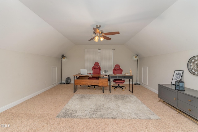 carpeted office space with lofted ceiling and ceiling fan